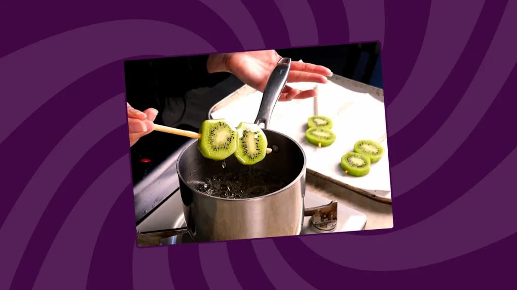 Dipping Kiwis into boiling sugar syrup