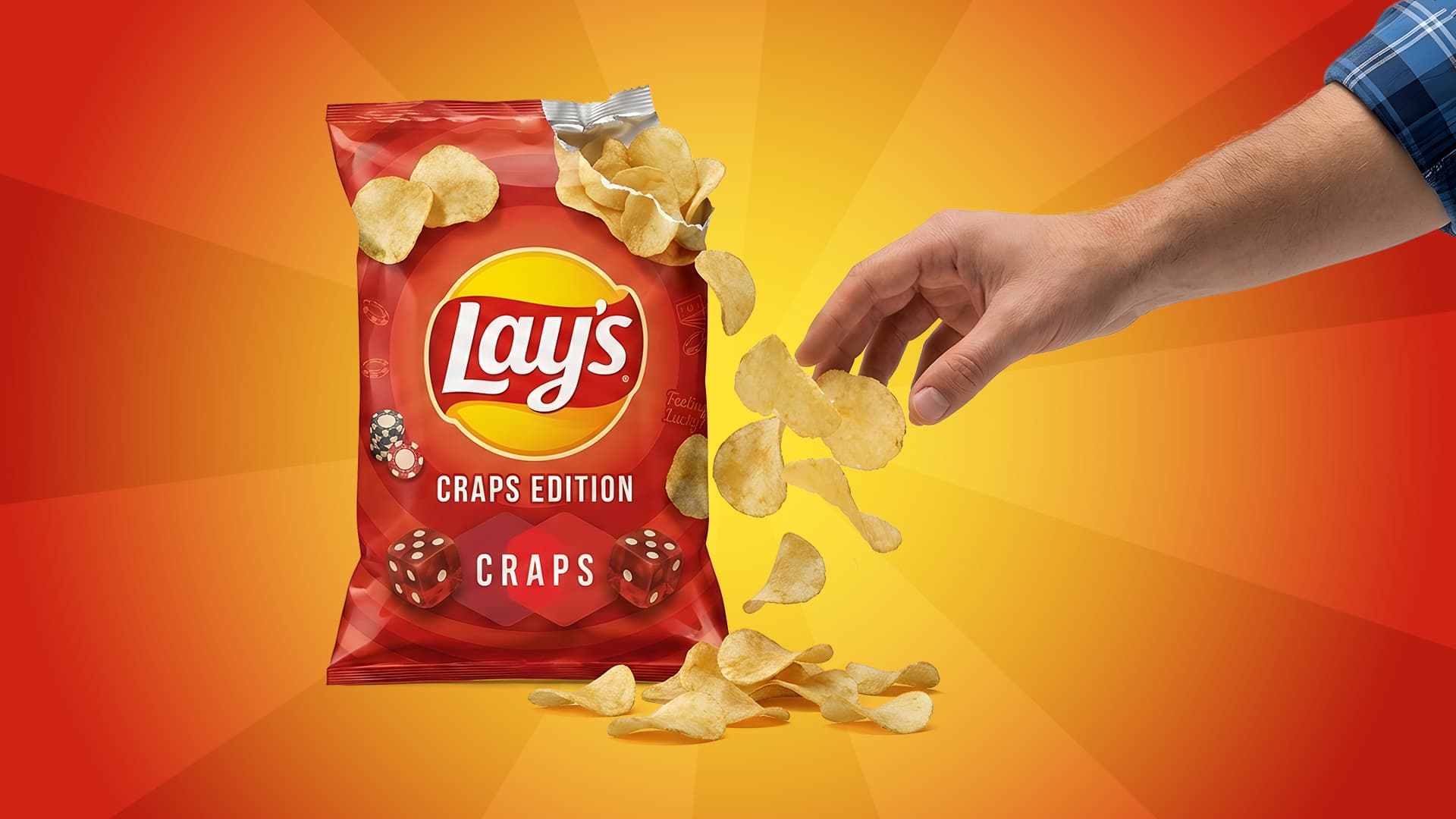 A bag of Lays potato chips is displayed on a red-and-orange screen. The chips are “Craps Edition,” reflecting the craps lay bet. A hand reaches out to grab potato chips tumbling from an opening in the bag.