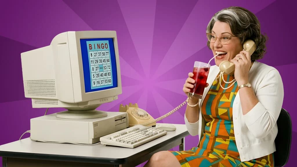 Sipping a berry spritzer, a lady plays Bingo on an old-school computer, ringing up someone on a rotary phone. She is learning the basics of playing bingo at a casino. 