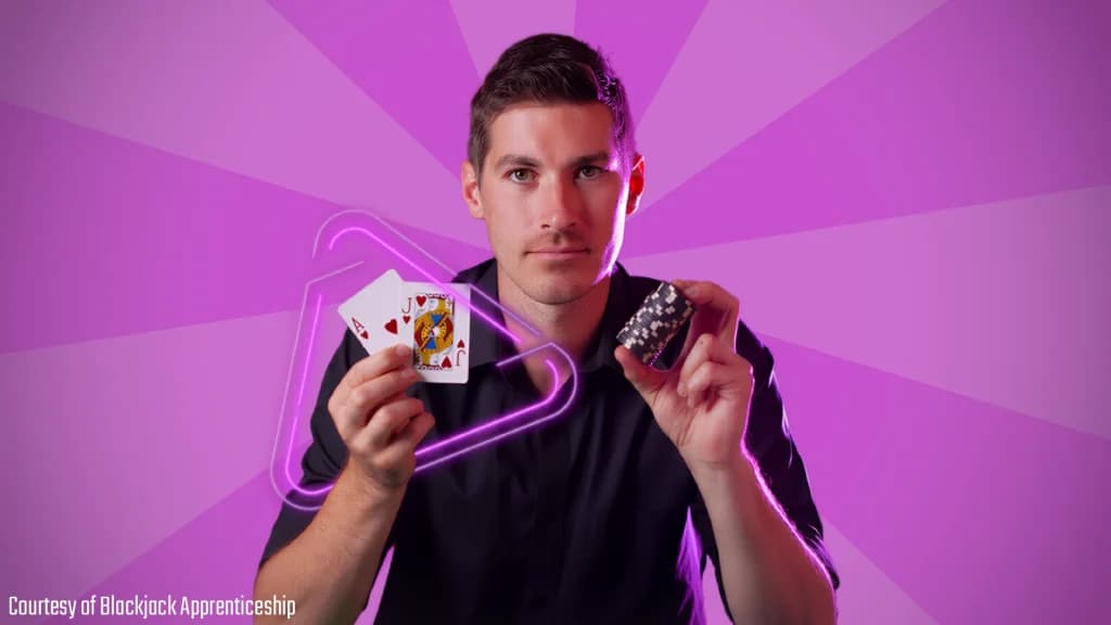 Colin Jones, co-founder of the Church Team and creator of Blackjack Apprenticeship, holding a blackjack hand and casino chips.