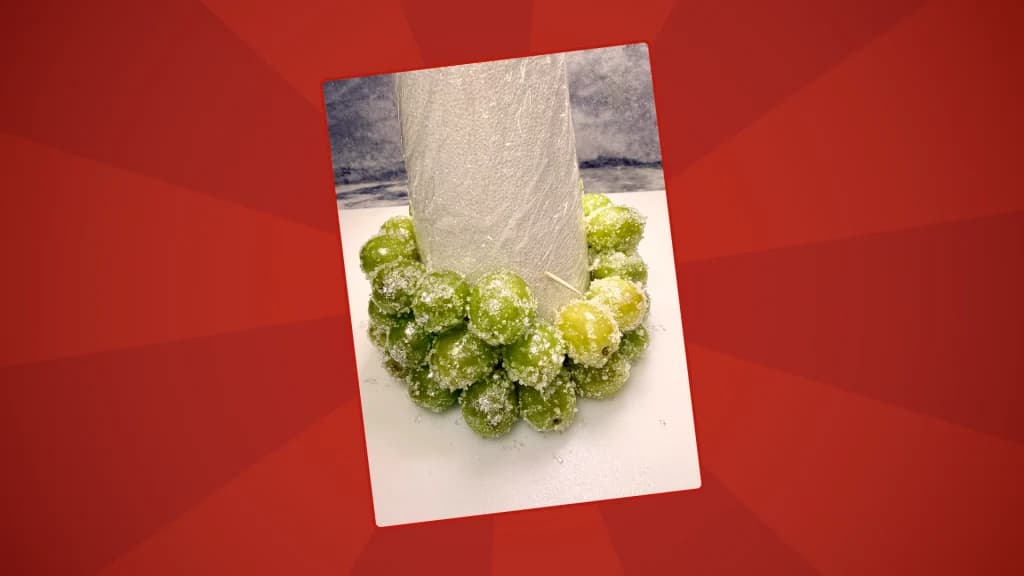 grapes being assembled on the cone with toothpicks