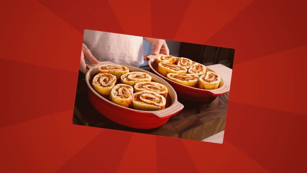 Rolled lasagne sheets in two baking dishes ready to cook