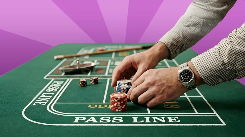 Chips are stacked on “odds” on a craps table, showing how to place a pass line bet plus odds.
