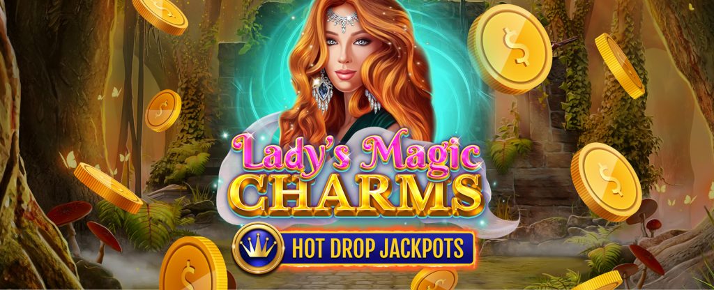 The background of a dark forest with the Cafe Casino slot game Lady’s Magic Charms logo overlaid, featuring a young woman with flowing red hair, a forehead chain and earrings, sounded by a green aura with the words Lady’s Magic Charms, with gold coins hovering around it overlaid with the Hot Drop Jackpots logo.