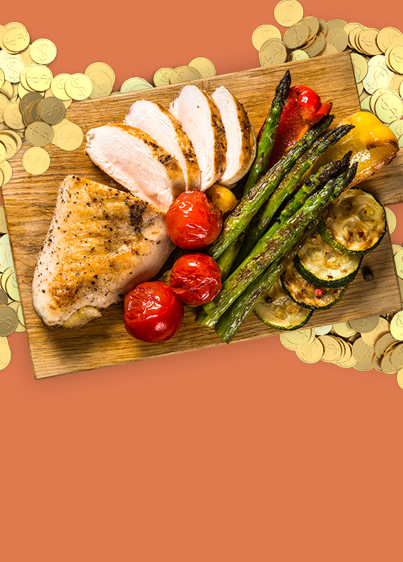 A Thanksgiving platter of turkey and roasted vegetables surrounded by gold coins from Cafe Casino online slots, against an orange pastel background