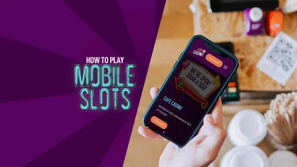 An image of a cafe table in the background, with a hand in the foreground holding up a mobile phone showing the Cafe Casino website, while on the left, a mostly neon sign reads “How to play mobile slots”.