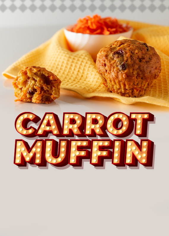 A yellow tea towel sits on a glossy white counter with a white bowl filled with grated carrot sitting on it, along with two carrot muffins. Below, are the words “carrot muffin” in Vegas-style font.