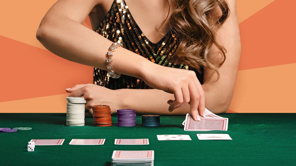 A woman live dealer deals a hand on a card table, set against an orange and apricot background.