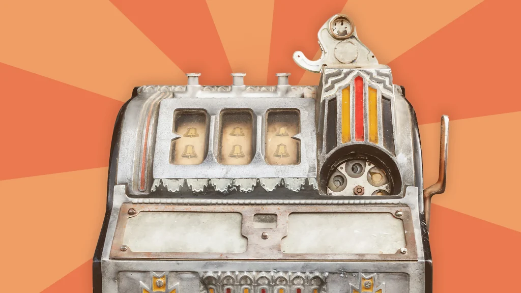 Vintage slot machine against an orange background.