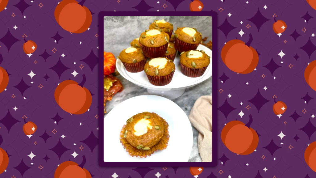 Pumpkin cream cheese muffins rest on a white cake plate, inside a frame, on a retro purple and orange background.