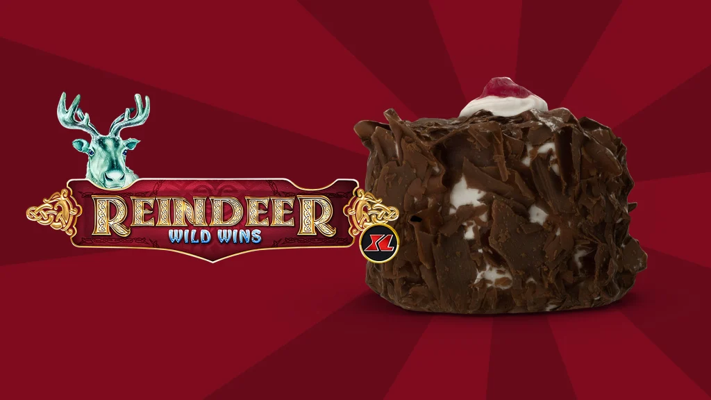 The Cafe Casino slots game logo for Reindeer Wild Wins XL beside a Black Forest chocolate cake, against a red background.