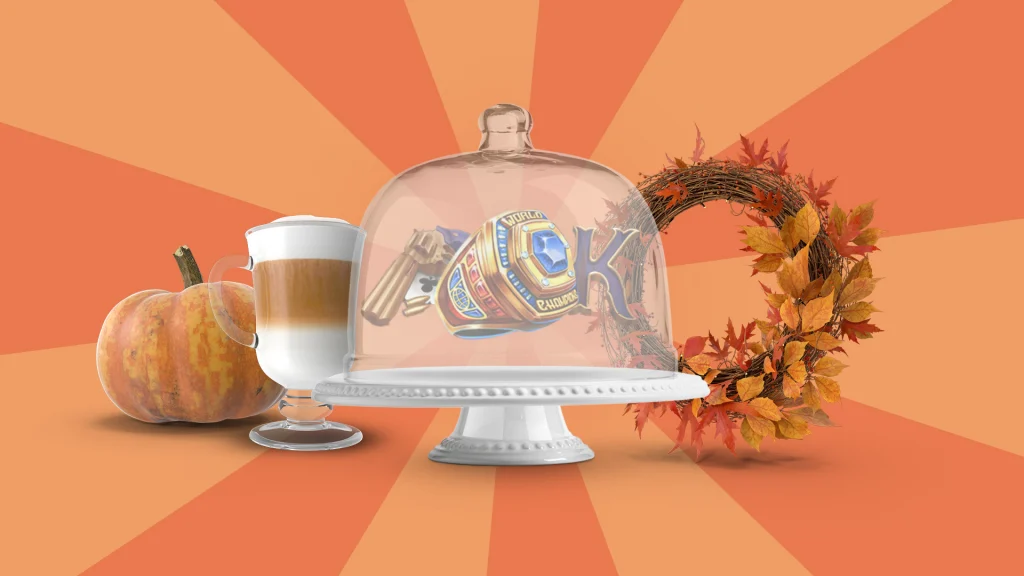 There’s a cake plate on a peach-orange background. Inside are a few symbols from Cafe Casino online slots, and outside is a wreath, pumpkin, and pumpkin-spiced latte.