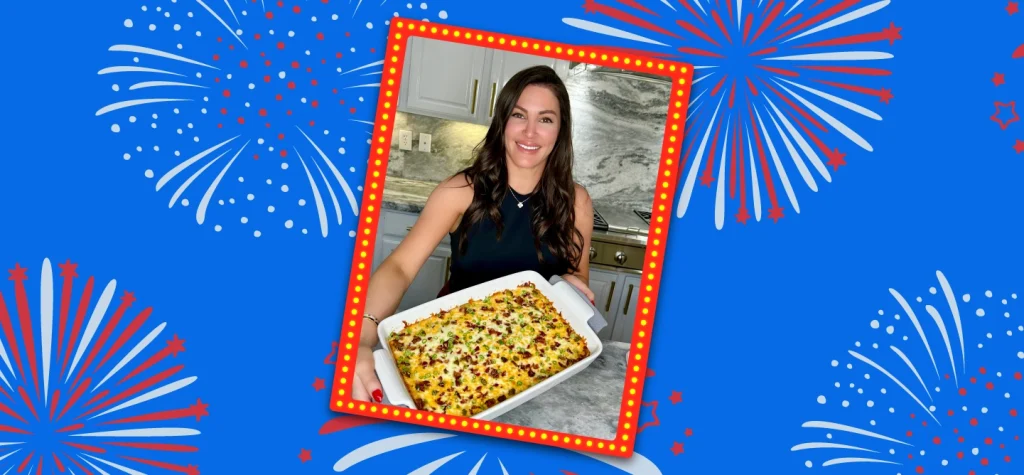 A woman holding a casserole dish with fireworks in the background, creating a vibrant and celebratory atmosphere.