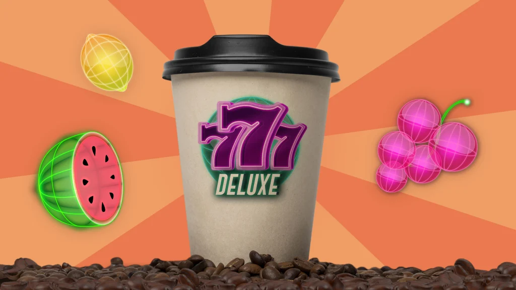 A white coffee cup says “777 Deluxe” and it’s standing on a pile of roasted coffee beans with various fruit symbols hanging around either side on a peach background.