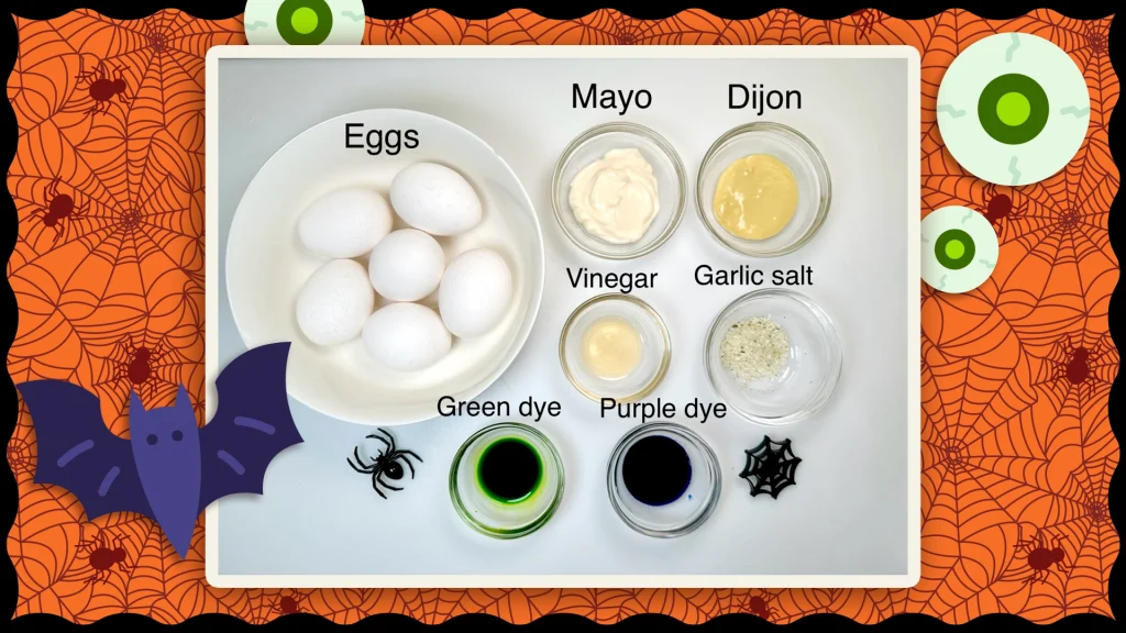 Spooky deviled eggs ingredients are shown on an orange background with spiderwebs