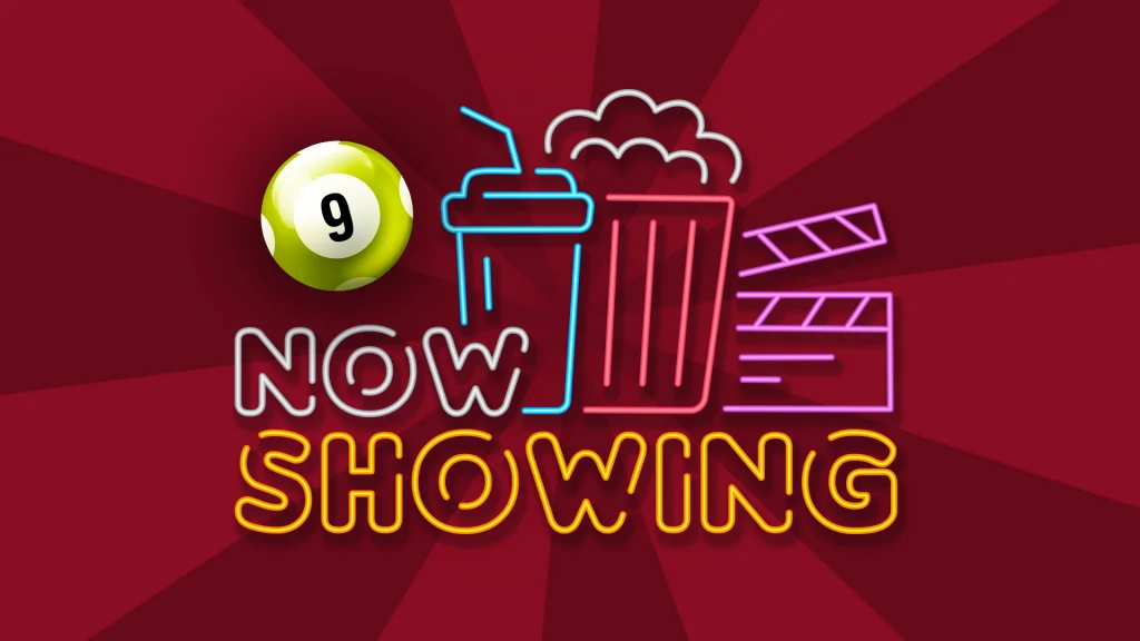 Blue, red, purple, white, and gold neon lights say, “Now Showing,” as well as the outline of a soda, popcorn, and a director’s clapperboard. A yellow ‘9’ bingo ball is on the top left. 