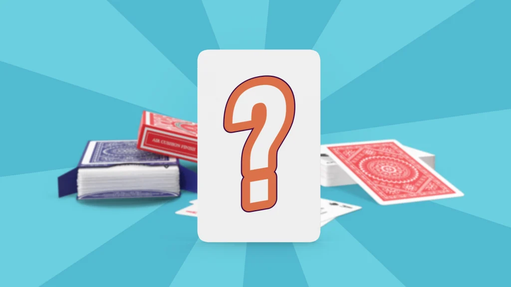 A white card in the center of a light blue image shows an orange-lined question mark symbol. Behind it are two decks of cards and various loose cards falling off the deck. 