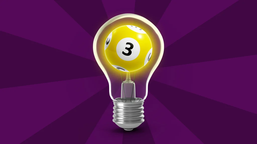 There’s a yellow bingo ball with the number three inside a lightbulb, and it’s in the center of a dark purple image. 