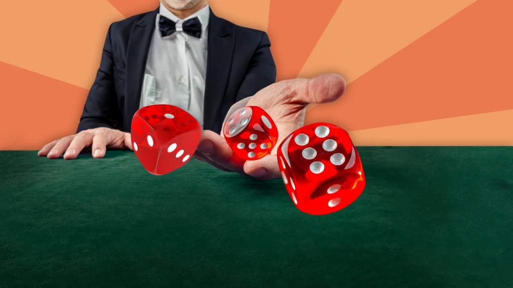 A dealer at a green felt table tosses three red and white dice toward the front of the image, and the background is peach.