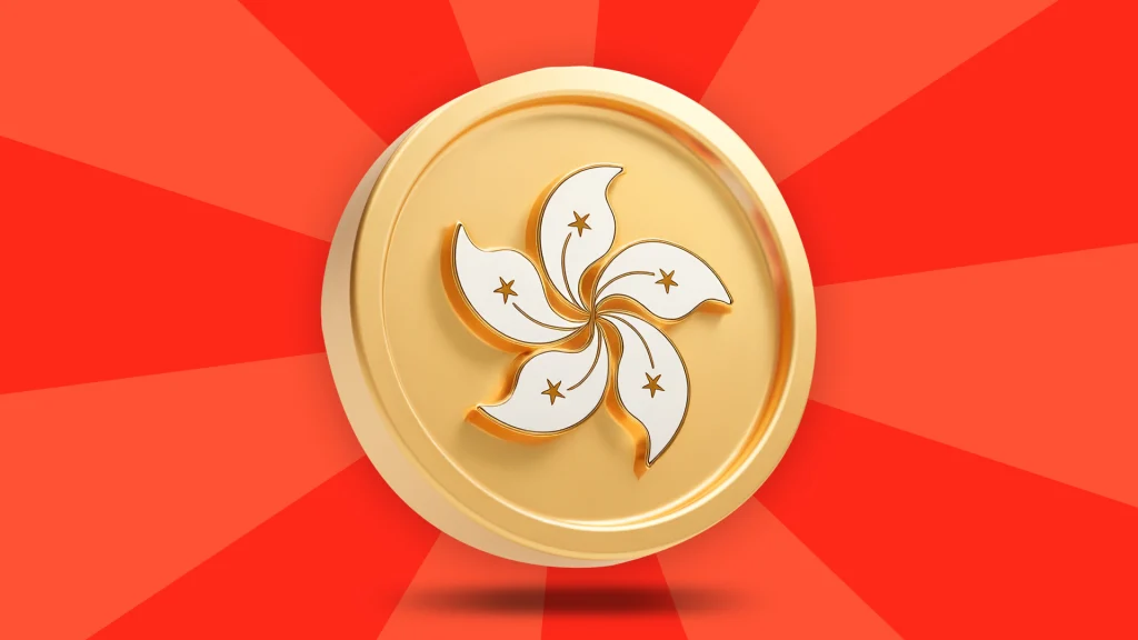 A gold coin with the emblem of Hong Kong is displayed in the center of a bright red image.