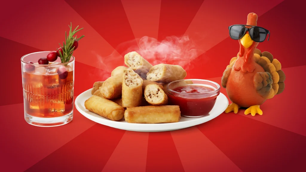 Turkey egg rolls with dipping sauce, a bourbon cocktail, and a turkey in sunglasses are shown on a red background. 