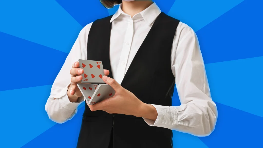 A dealer in formal attire shuffles a deck of cards on a blue background. 