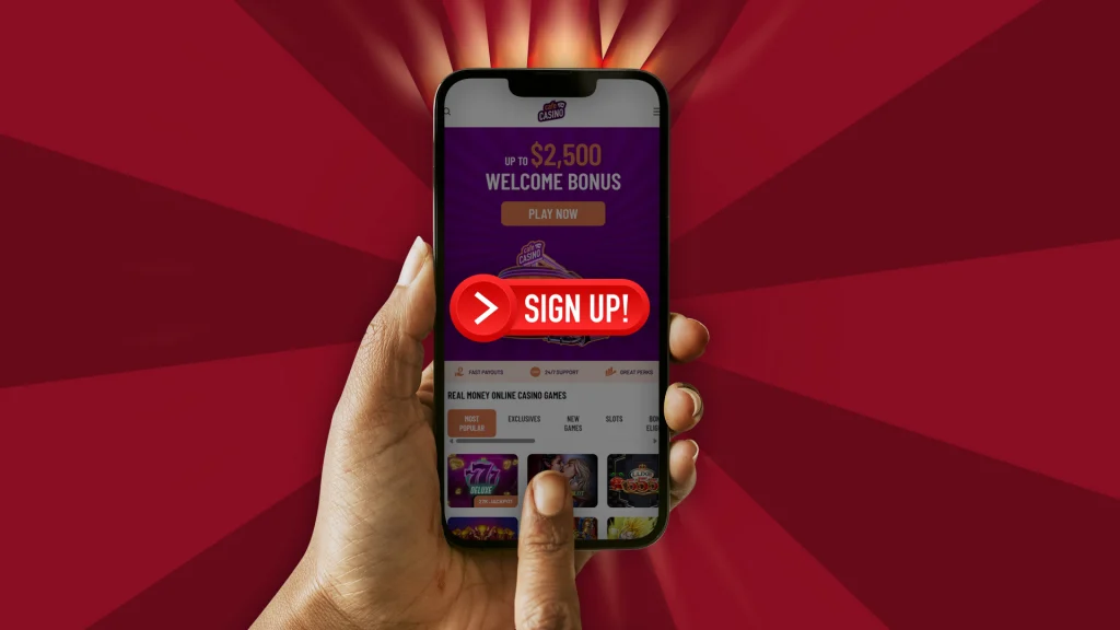 Someone holds a mobile phone that says, “Sign up” in red on the Cafe Casino website. The background is dark red. 