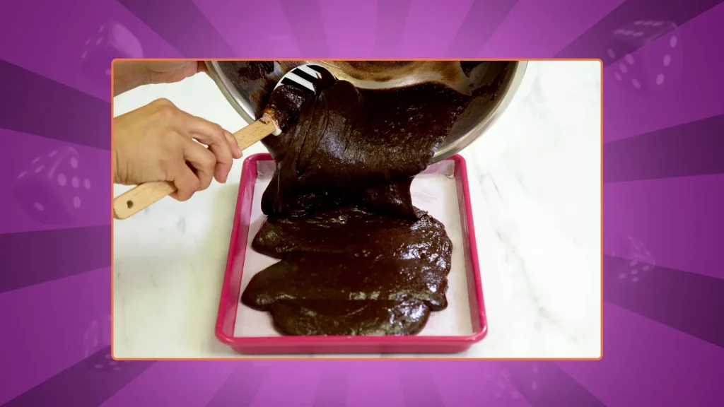 Brownie mixture is poured into a rectangular oven dish