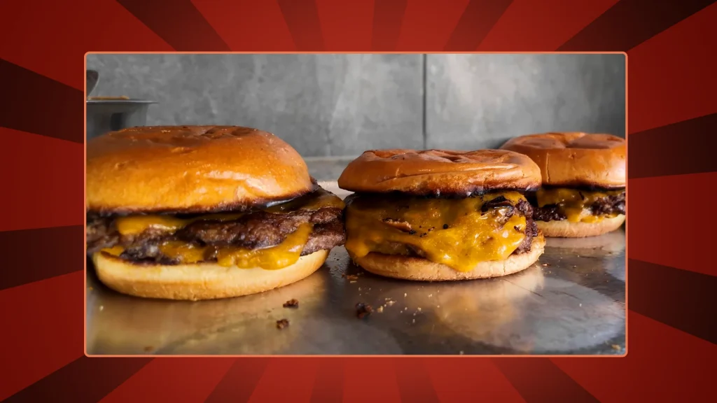 3 smash burgers on a red background